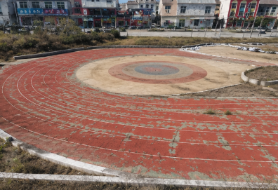 Worn, cracked athletics track before resurfacing