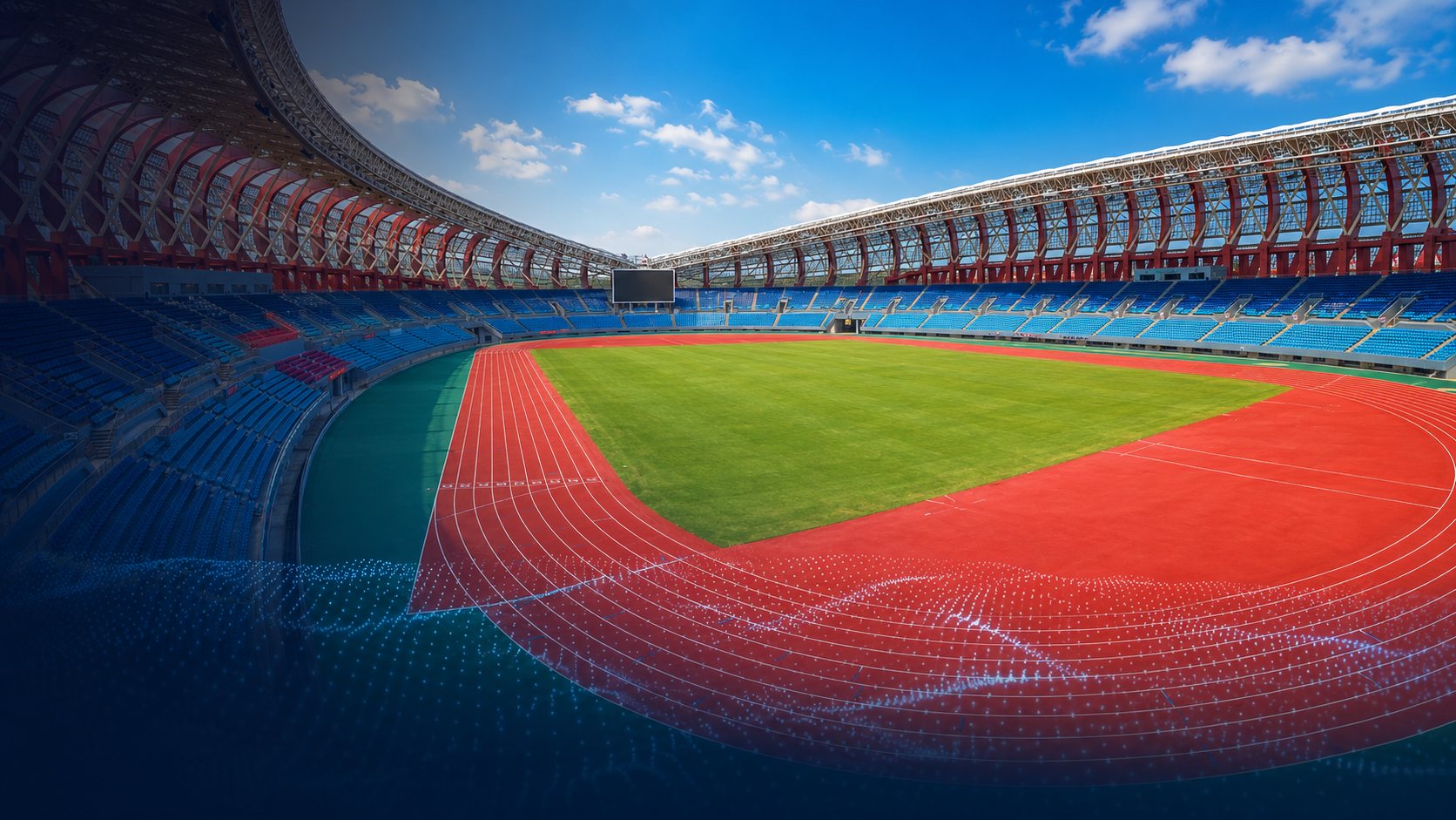 Modern athletics stadium with a red running track, green field and tiered blue seating under a bright sky